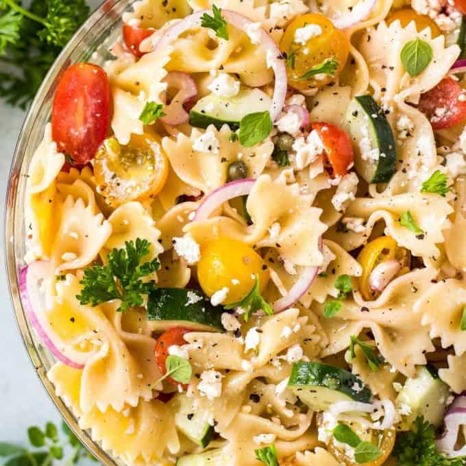 Colorful pasta salad with cherry tomatoes and herbs.