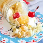 Dessert spilled from jar onto floral plate.