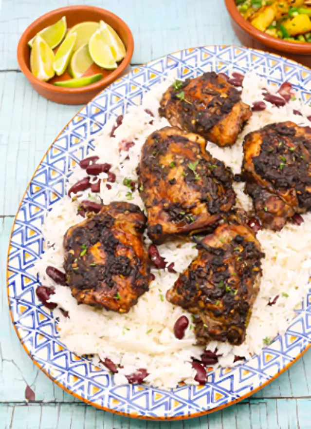 Grilled chicken with rice and beans.